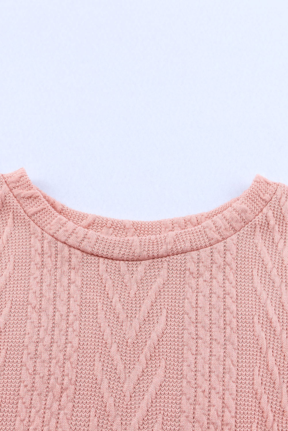 Pale Blush textured chevron knit sweater with crew neck and cable knit details.