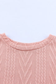 Pale Blush textured chevron knit sweater with crew neck and cable knit details.
