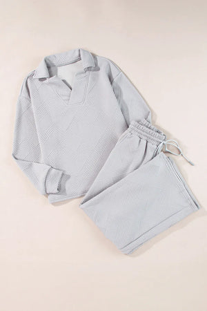Gray textured quilted knit collared lounge set with v-neck and drawstring pants.