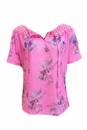 Hot Pink floral blouse with lace yoke and tie-neck detail.