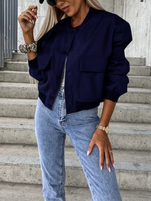 Navy bomber jacket with sculpted sleeves, button front, and chest pockets.