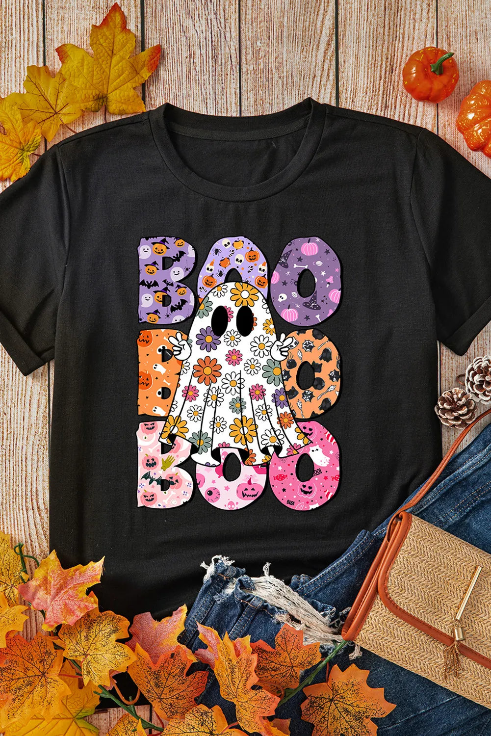 Black t-shirt with floral ghost and "Boo" Halloween graphic.