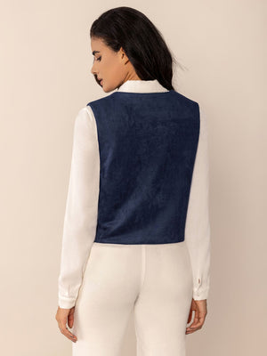 Dark blue suede-effect vest with stitch trim detail worn over a white shirt.
