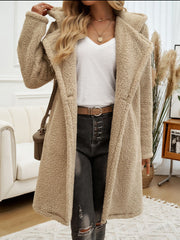 Camel teddy hooded cocoon coat with a relaxed fit and plush texture.