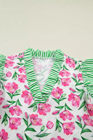 Tulip print V-neck blouse with green striped ruffles and polyester fabric.