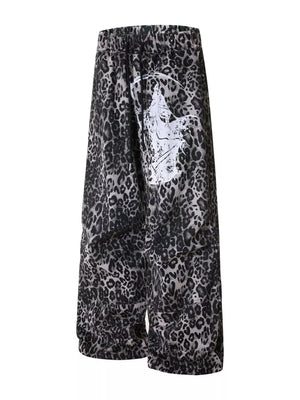 Leopard print cotton sweatpants with drawstring waist and wide leg, featuring a graphic print detail.