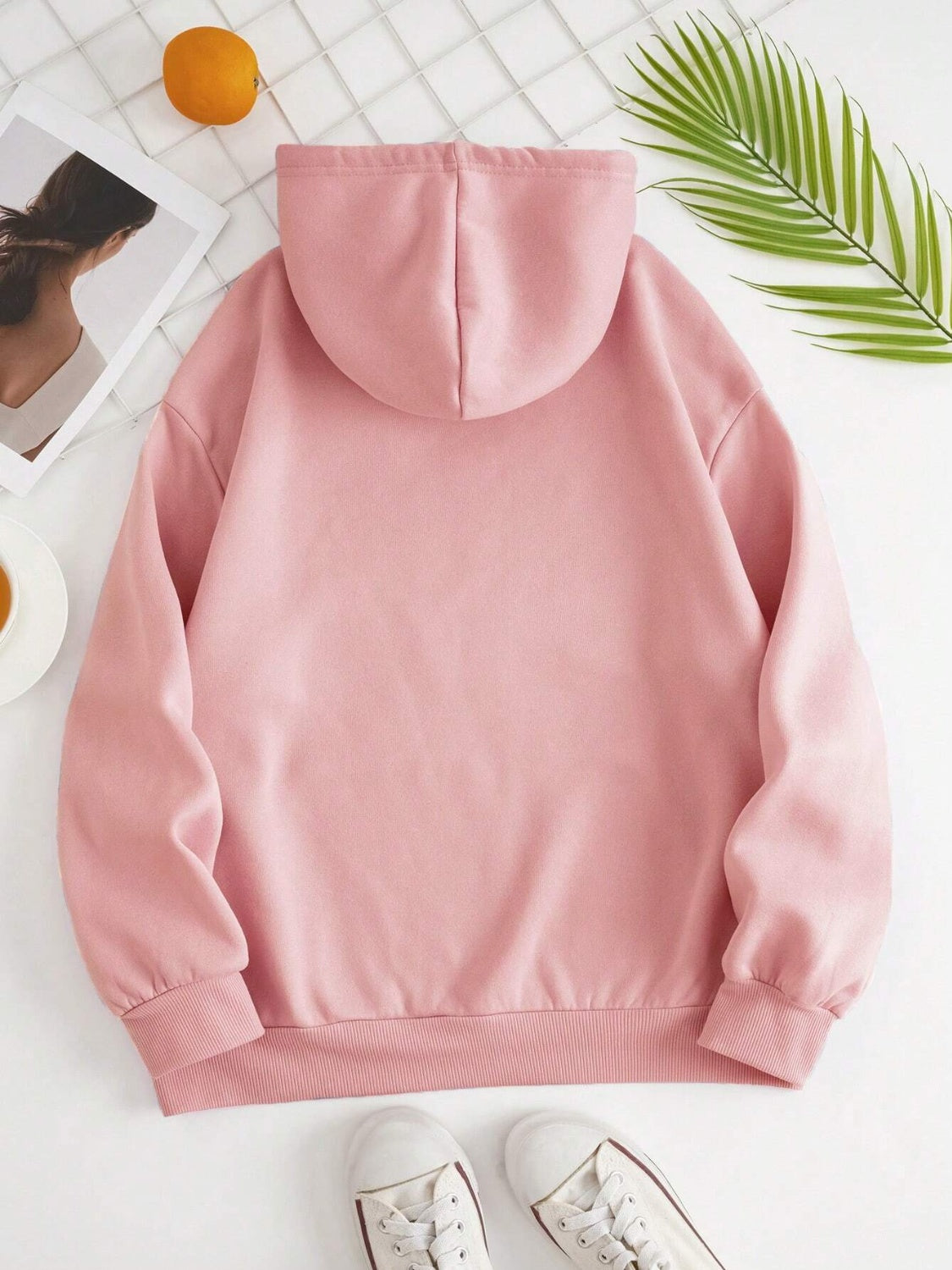 Oversized blush pink hoodie with pouch pocket and ribbed cuffs and hem