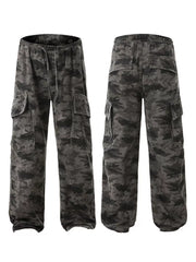 Urban camouflage cargo sweatpants in cotton with drawstring waist and multiple pockets.
