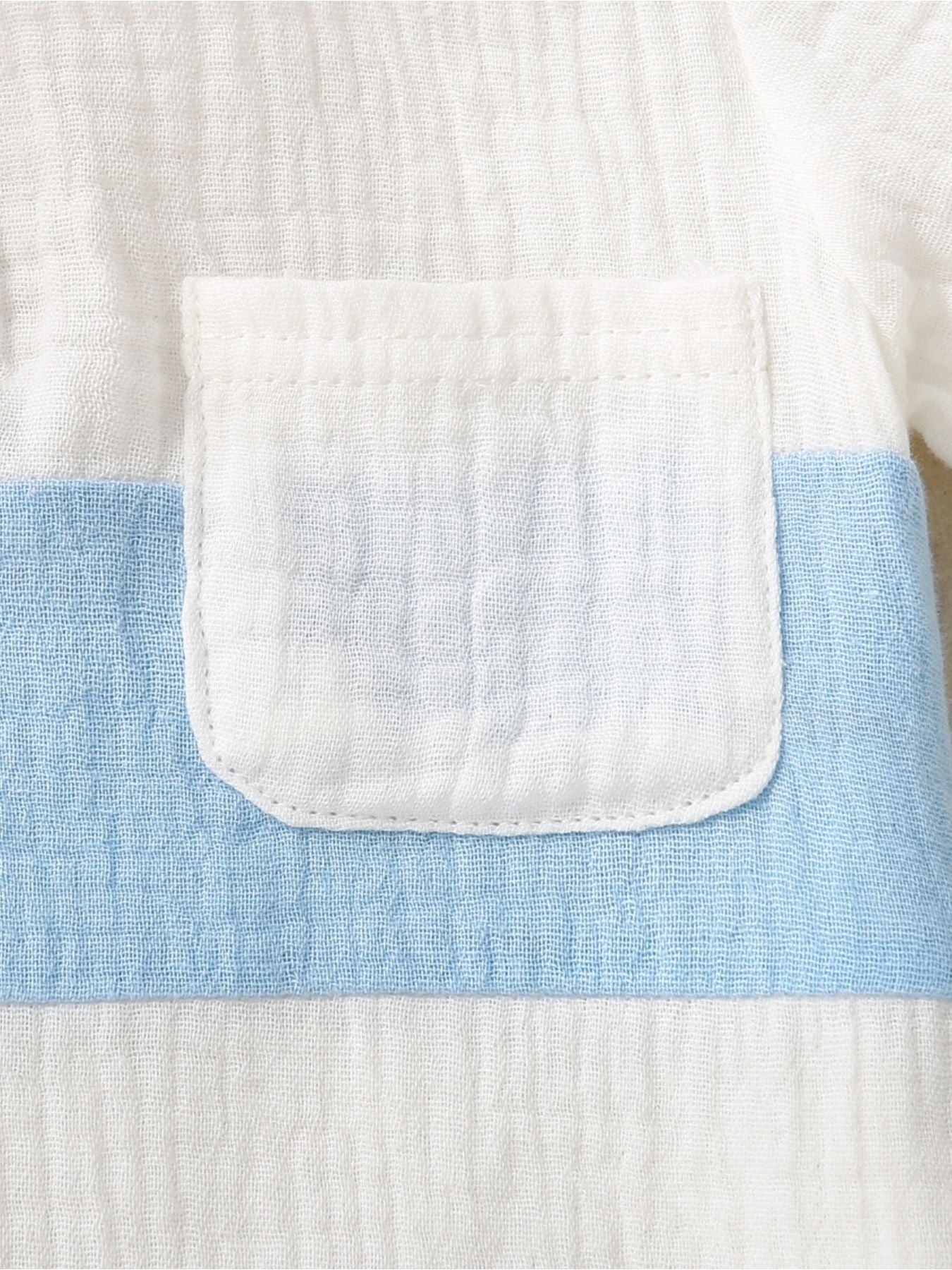 Children's cotton color-block top with a white pocket and blue stripe detail.