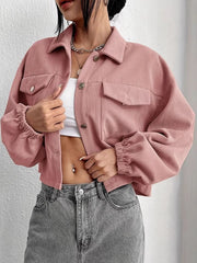 Pale blush corduroy blouson jacket with cropped length and elastic cuffs.