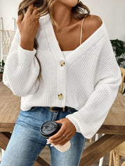 White balloon sleeve button-down knit cardigan with two buttons and a V-neck.