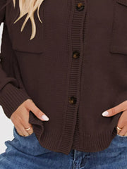 Brown knit cardigan with button-down front, chest pockets, and ribbed cuffs.
