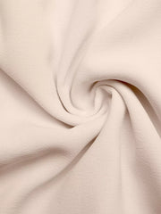 Beige midi dress fabric detail with subtle texture and soft drape.