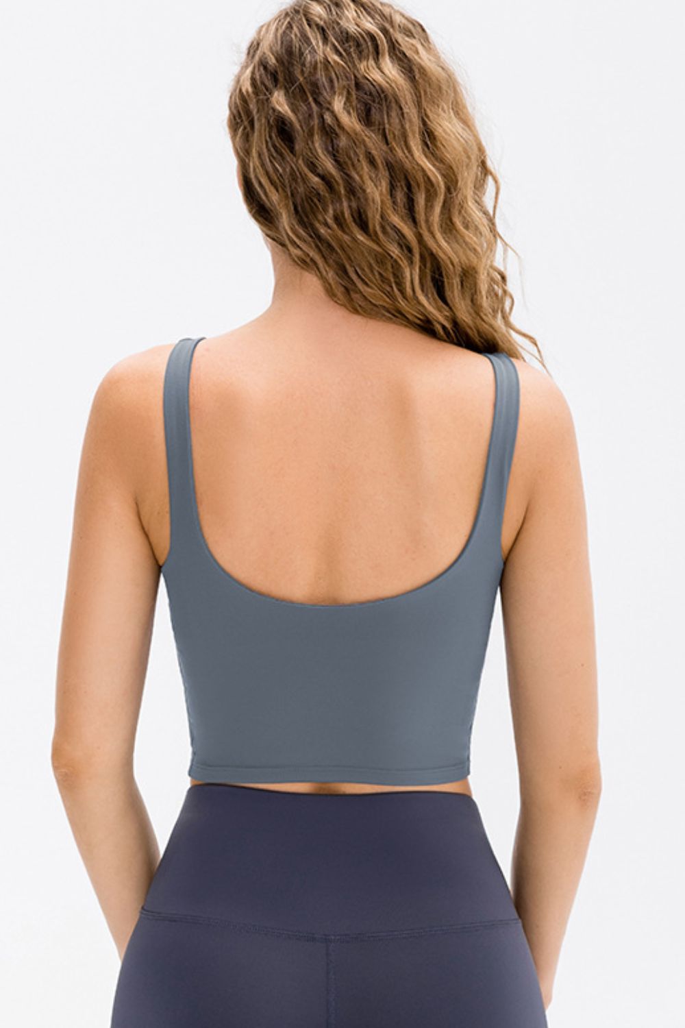 Performance scoop crop top in Cloudy Blue with a racerback detail.