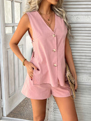 Dusty pink linen vest with buttons and side slits, paired with matching shorts.
