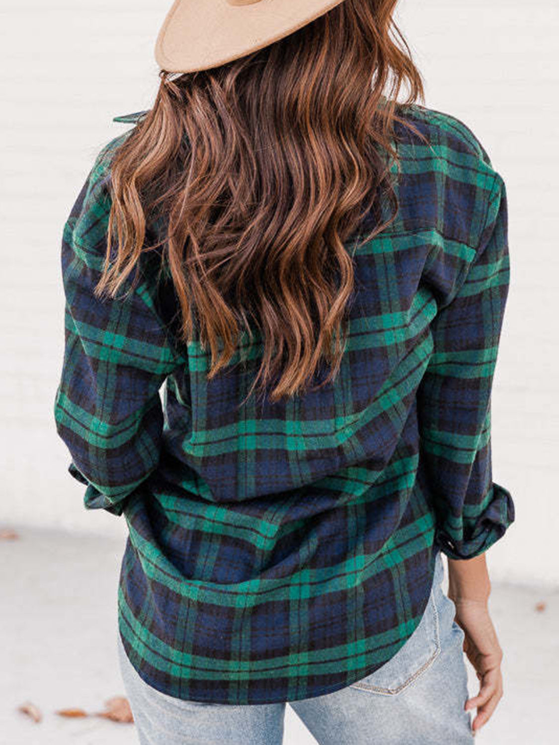 Relaxed fit plaid button-down shirt in green and navy blue, with rolled sleeves.