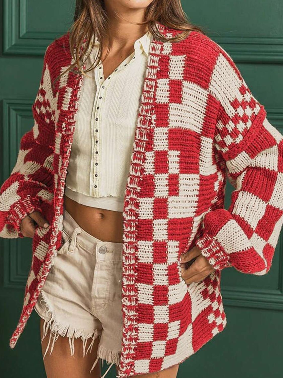 Chic checkered red and beige acrylic cardigan with balloon sleeves.