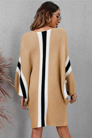 Oversized knit cocoon dress in khaki with black and white vertical stripes and sleeve stripes.