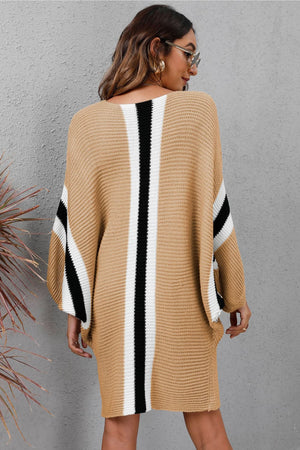 Oversized knit cocoon dress in khaki with black and white vertical stripes and sleeve stripes.