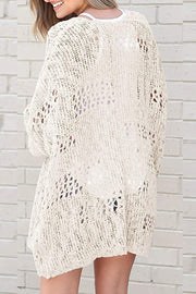 Cream open-knit slouchy cardigan with a relaxed fit and intricate cutout details.