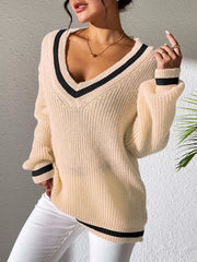 Cream ribbed knit sweater with V-neck and black varsity stripes on neckline and cuffs.