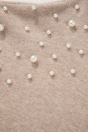 Dust Storm knit sweater with scattered pearl embellishments and balloon sleeves.