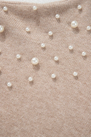 Dust Storm knit sweater with scattered pearl embellishments and balloon sleeves.