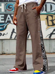 Dark Brown sweatpants with wide legs, side snaps, and bandana print panels.