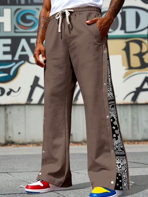 Dark Brown sweatpants with wide legs, side snaps, and bandana print panels.