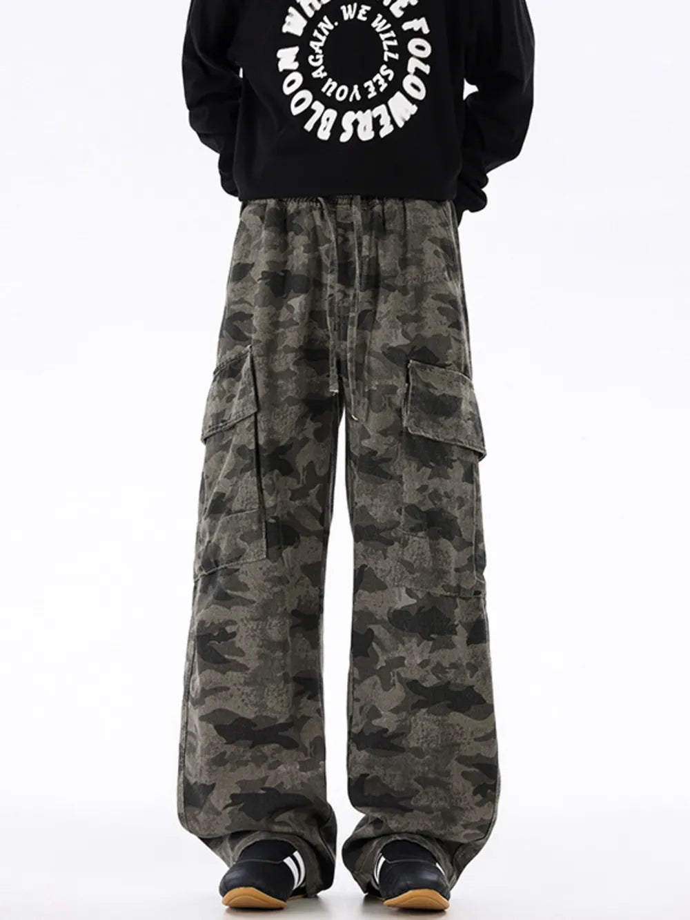 Urban camouflage cargo sweatpants with drawstring waist and multiple pockets.