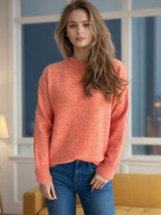 Orange textured knit crew neck pullover sweater with ribbed cuffs and hem.
