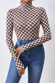 Checkerboard mesh turtleneck bodysuit in dark brown and white, long sleeves, sheer fabric.
