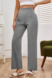 Gray high-waisted flare leg trousers with pockets and a comfortable fit.