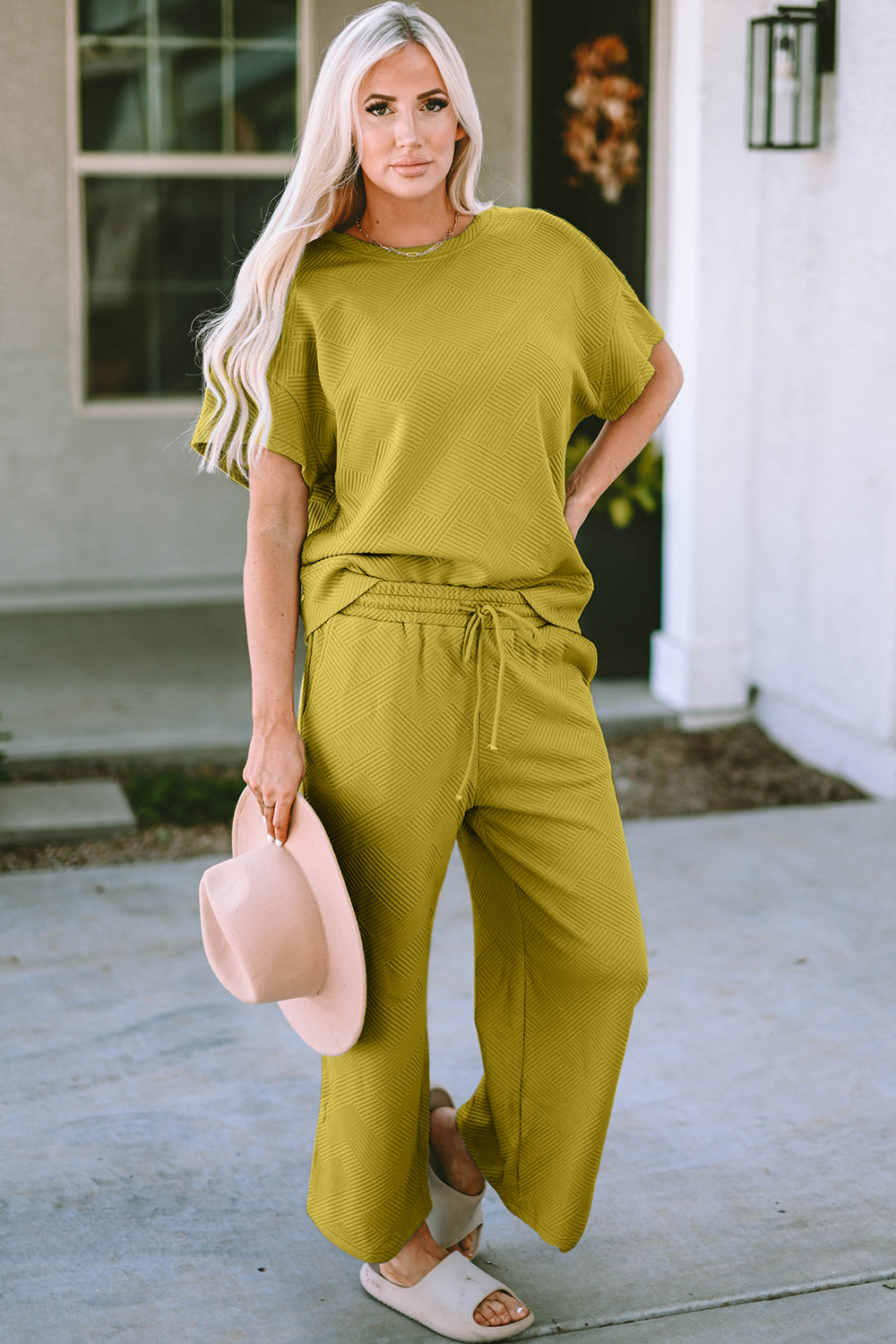 Textured knit tee and wide leg pants set in chartreuse with a geometric pattern.