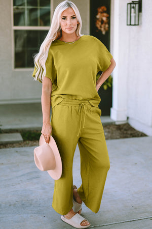 Textured knit tee and wide leg pants set in chartreuse with a geometric pattern.