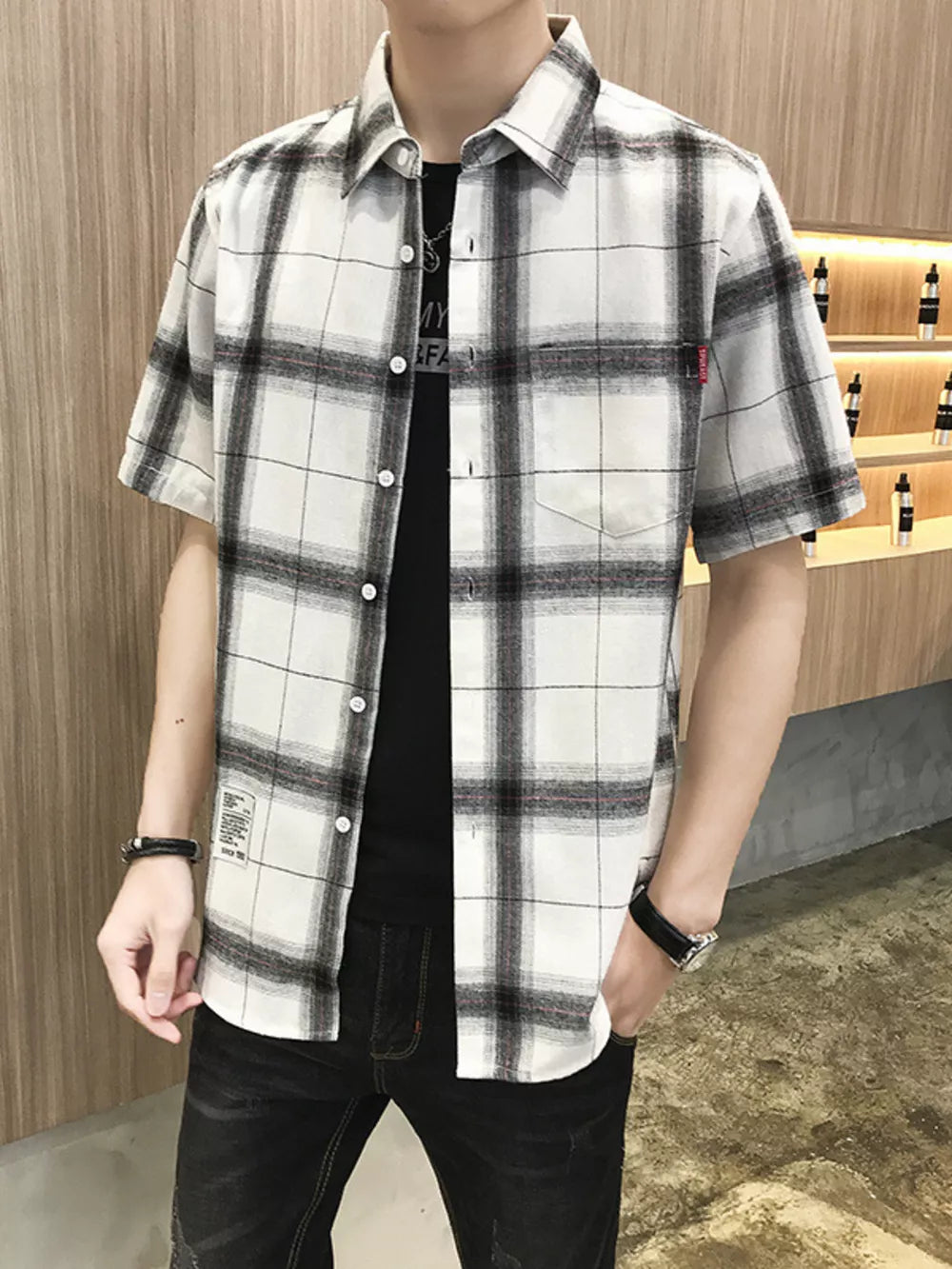 Classic oversized plaid short sleeve button-down shirt in white with black and red plaid.