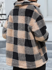 Plaid sherpa overshirt jacket in black and tan with a fuzzy texture and collar.