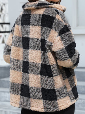 Plaid sherpa overshirt jacket in black and tan with a fuzzy texture and collar.