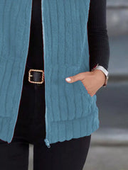 Sky blue fleece zip-up vest with pockets and textured detail.