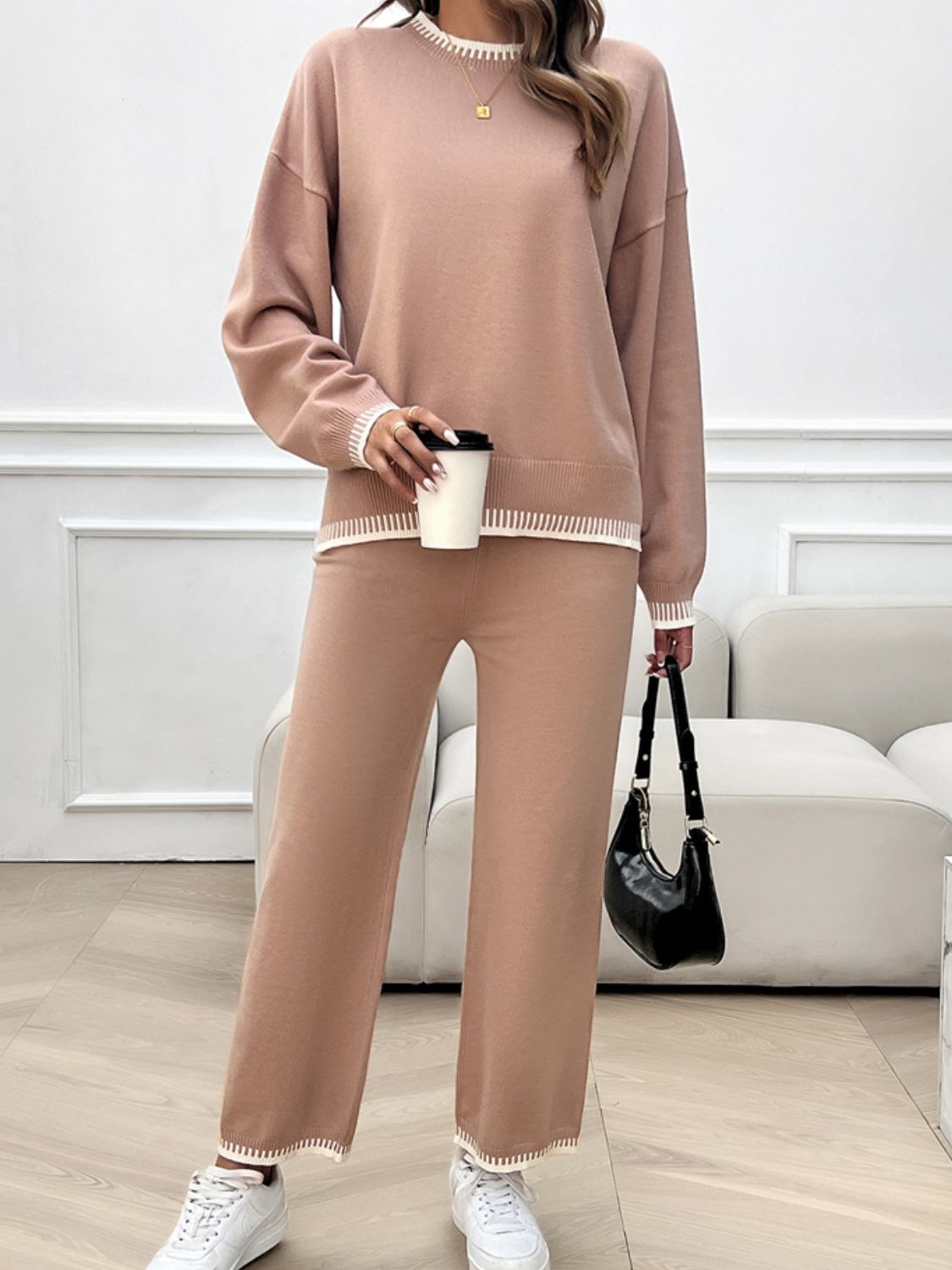 Pale blush knit lounge set with ribbed trim detail on neckline, cuffs, and hem.