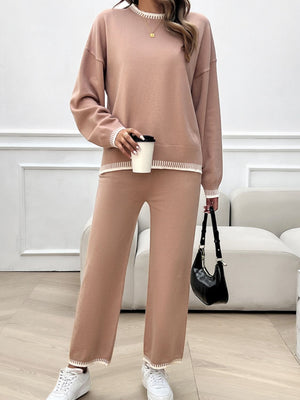 Pale blush knit lounge set with ribbed trim detail on neckline, cuffs, and hem.