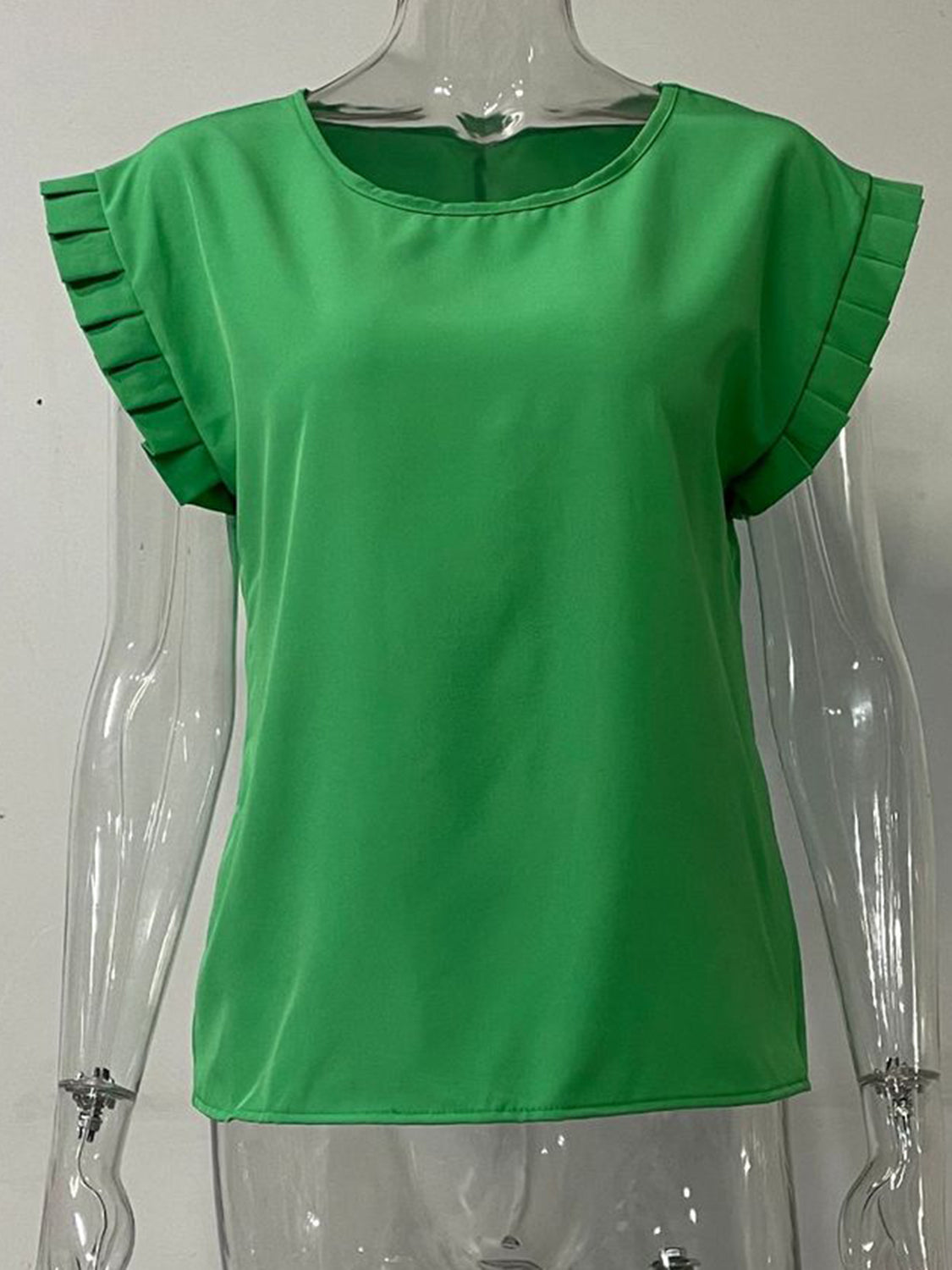 Green cap-sleeve blouse with pleated sleeve detail