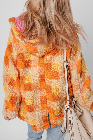 Checkerboard sherpa jacket in tangerine with contrast pink trim and hood.