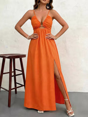 Orange maxi dress with cutout detail, O-ring accent, spaghetti straps, and high slit.