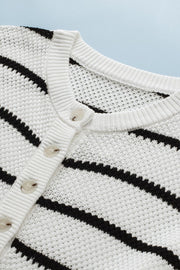Button-down stripe knit pullover sweater in white with black stripes and round neckline.