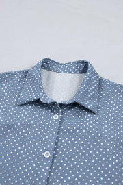 Blue polka dot polyester shirt with button front and collar detail.