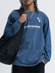 Relaxed fit royal blue long-sleeve tee with contrast stitching and graphic print.