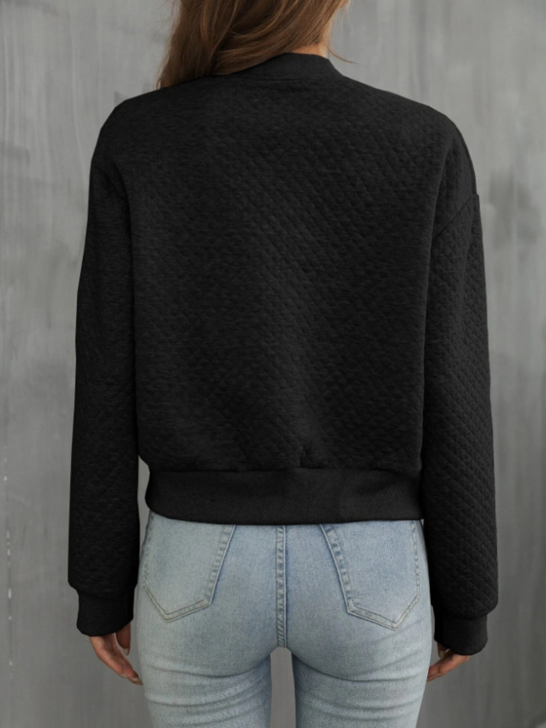 Black diamond quilted bomber jacket with ribbed cuffs and hem.