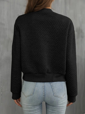 Black diamond quilted bomber jacket with ribbed cuffs and hem.