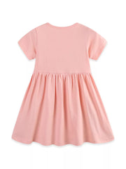 Pink cotton toddler dress with short sleeves, gathered waist, and appliqué detail.